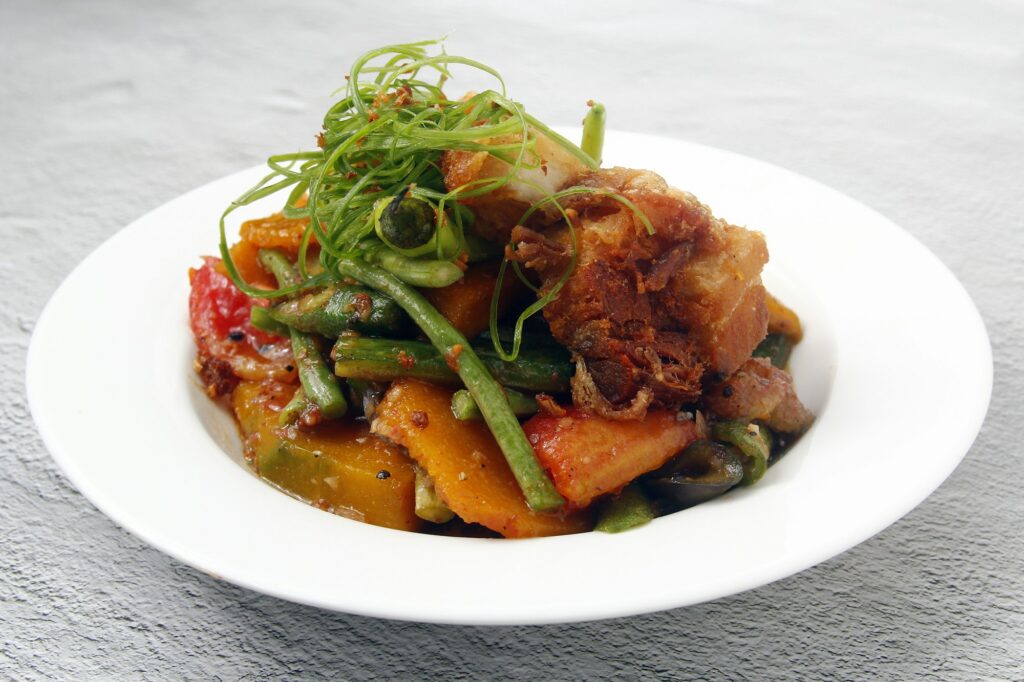 Freshly cooked Filipino food called Pork Pinakbet